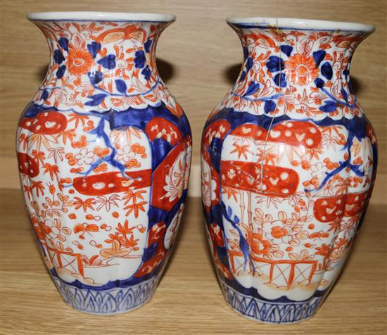 A pair of Imari vases, 24cms, one a.f.